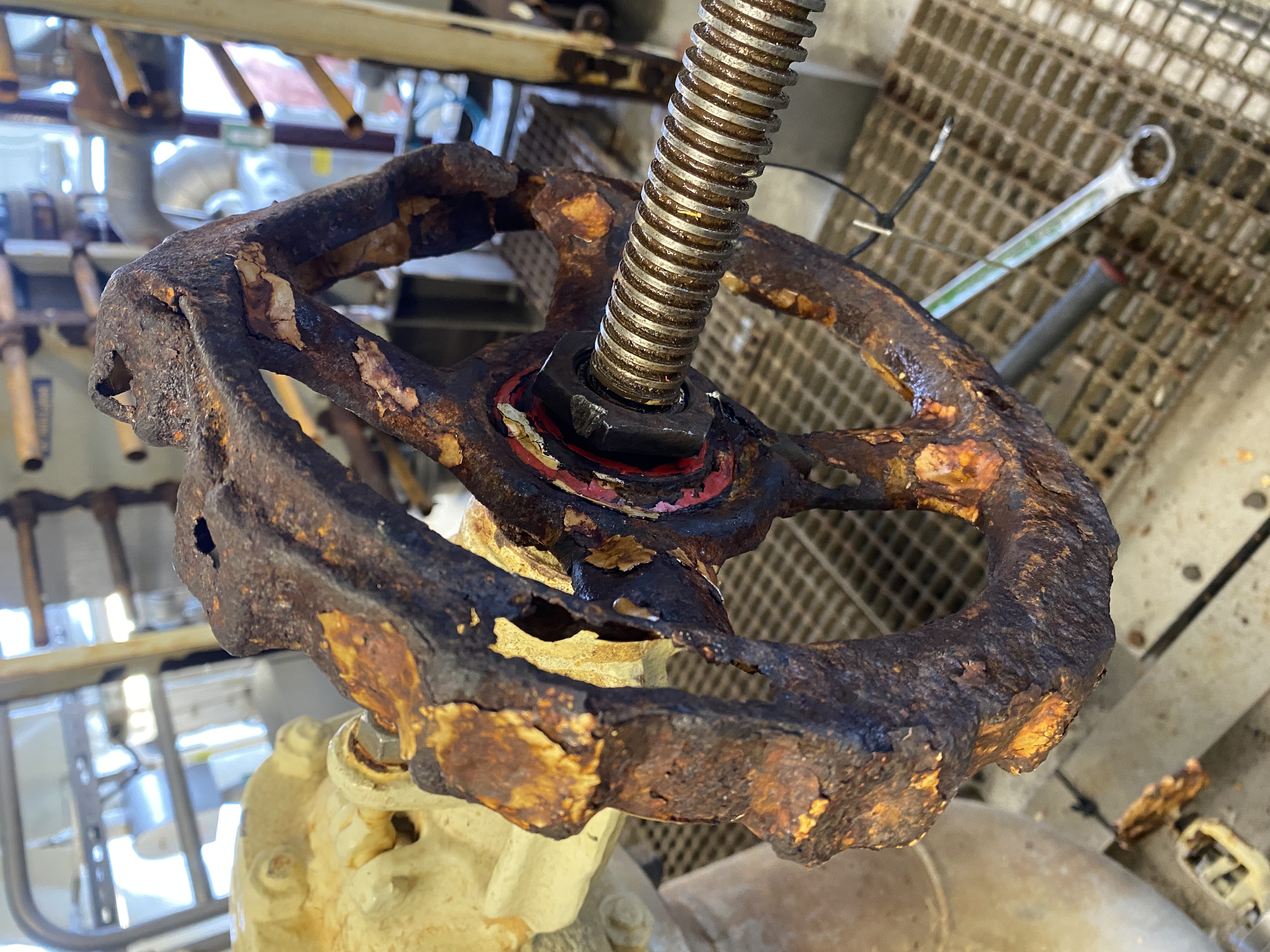 Broken hand wheel with gaping holes in the metal